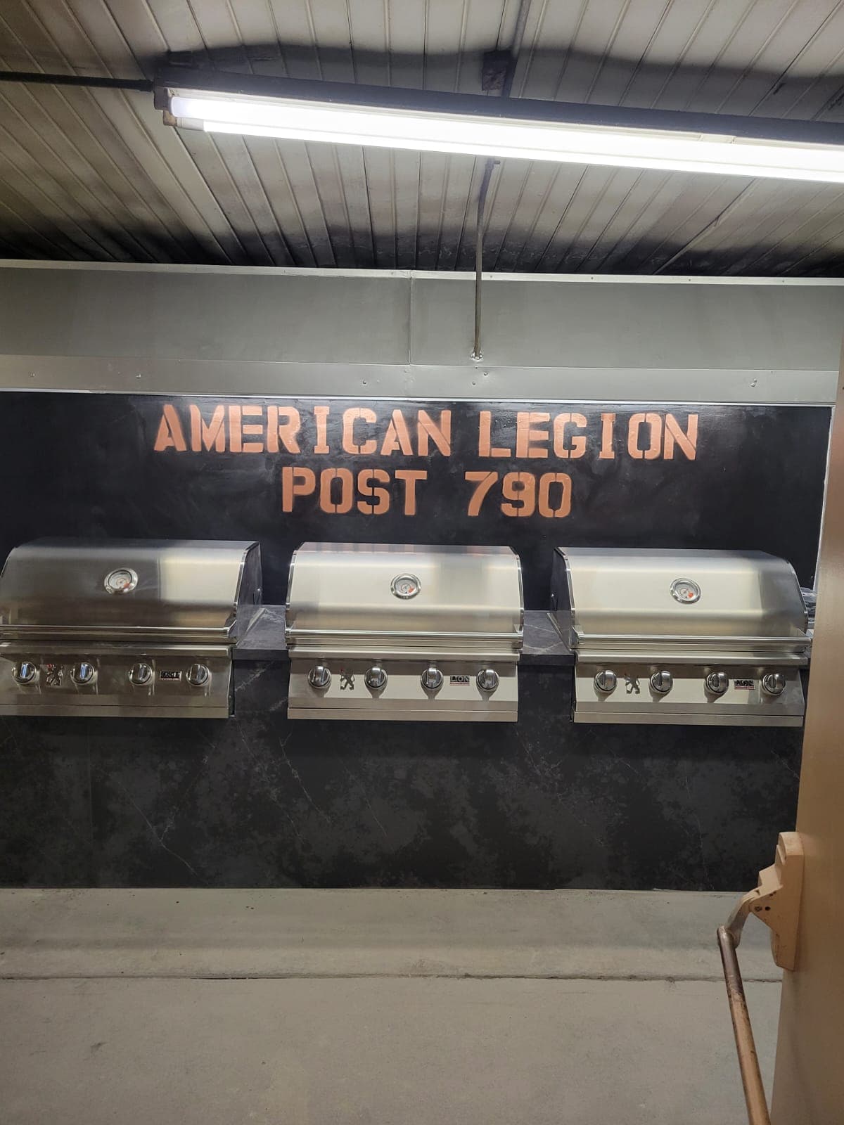 Three stainless steel grills at American Legion Post 790, ready for outdoor cooking.